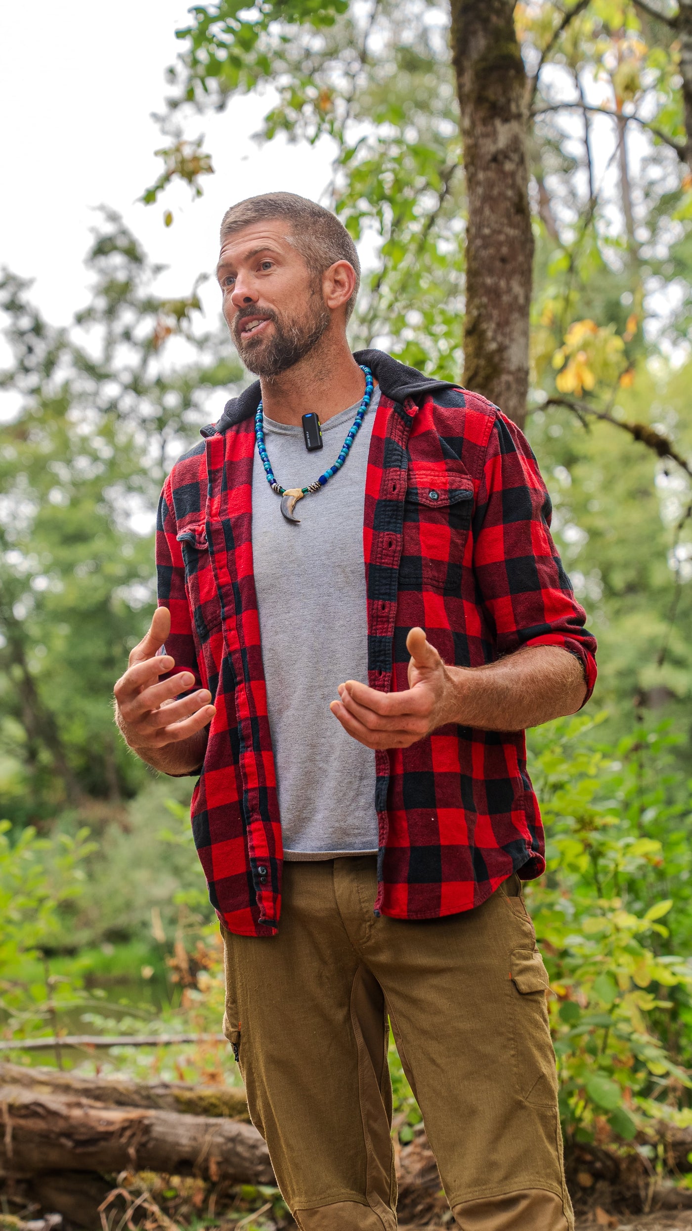 An instructor speaking to competitors in the woods during the 2026 PNW Survival Games